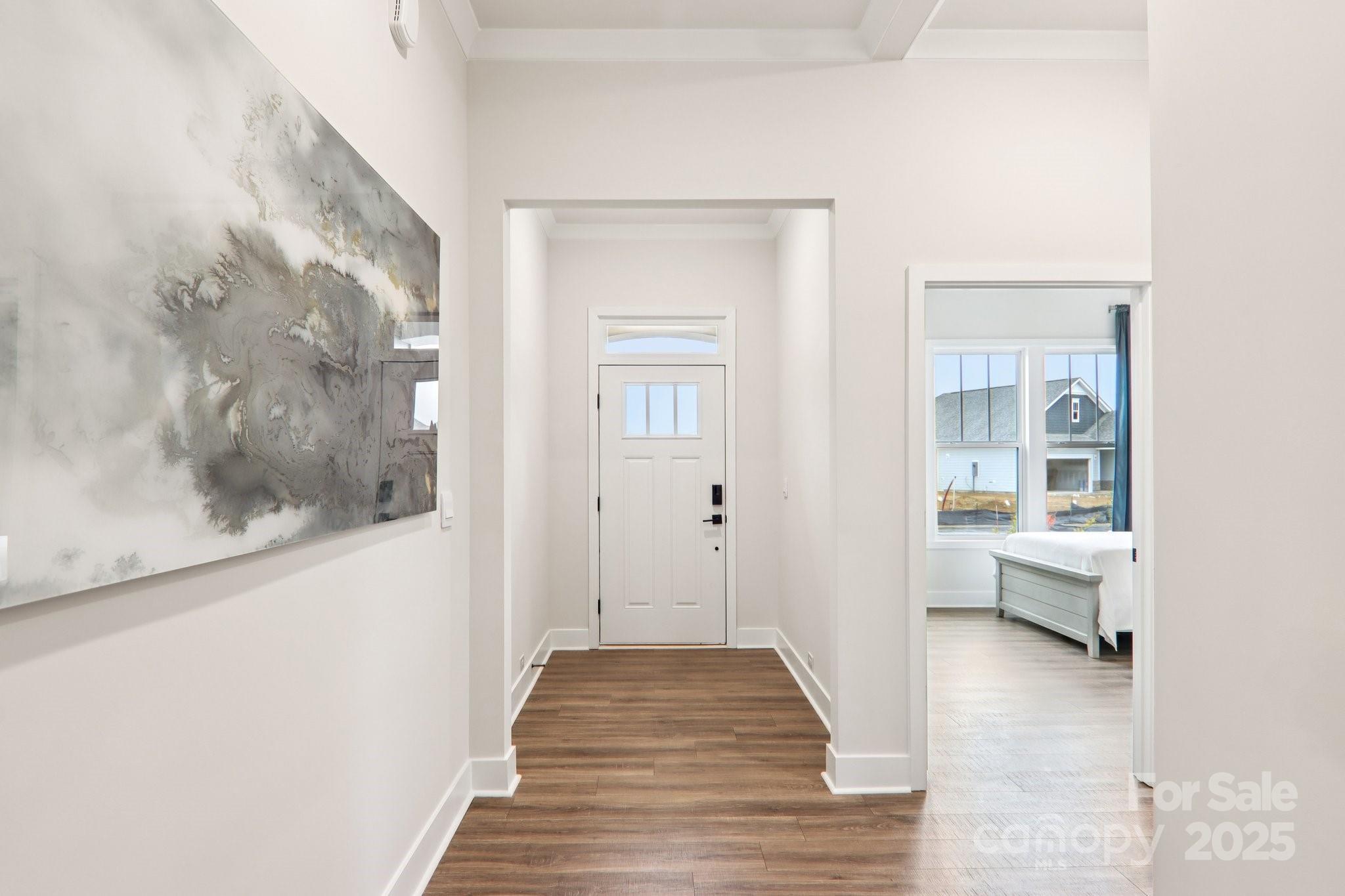 623 River Btm Road Fletcher, NC 28732 - Photo 3 of 48 a view of a hallway with wooden floor and a bathroom