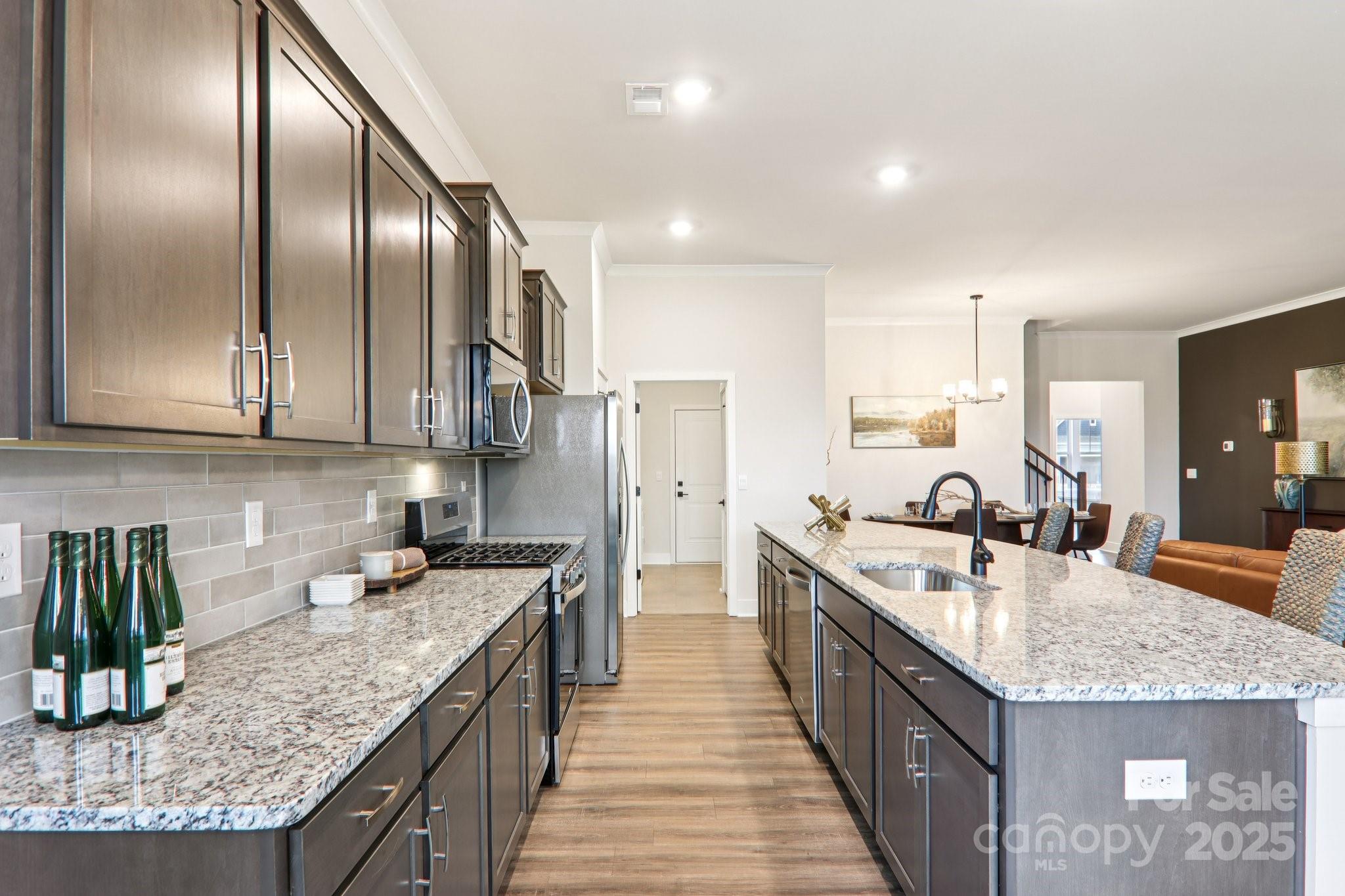 623 River Btm Road Fletcher, NC 28732 - Photo 6 of 48 a kitchen with stainless steel appliances granite countertop a sink stove and refrigerator