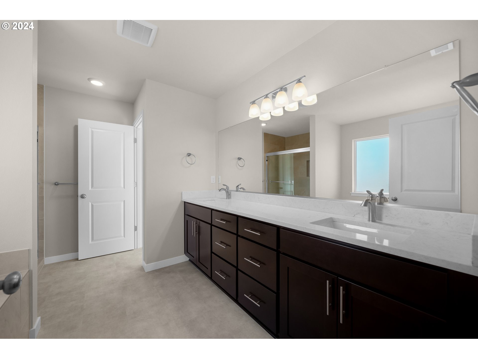 4361 Chaparal Place Albany, OR 97321 - Photo 15 of 36 a bathroom with a granite countertop sink a light fixture and a mirror