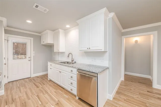 a kitchen with stainless steel appliances granite countertop a stove and a sink