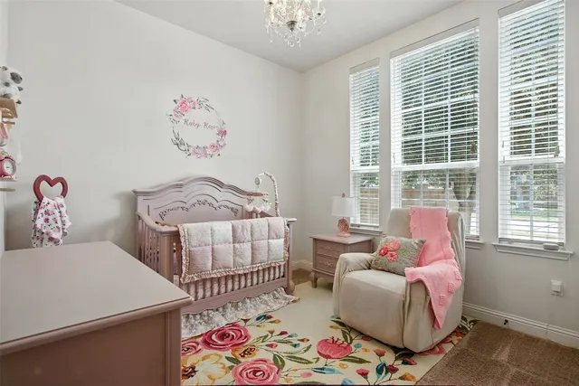 a bedroom with furniture and a window