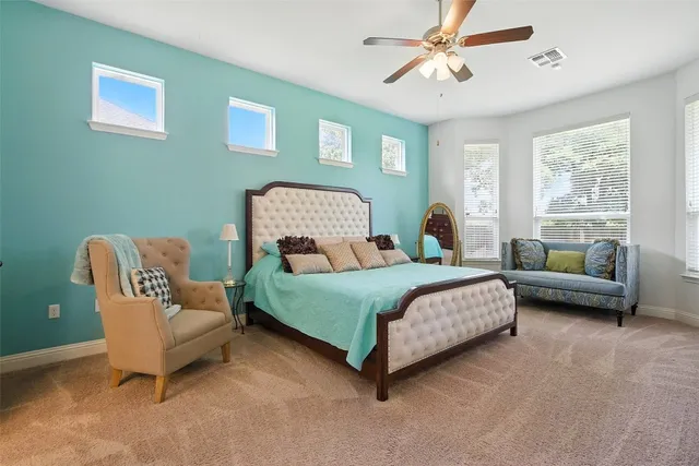 a bedroom with a bed and a couch