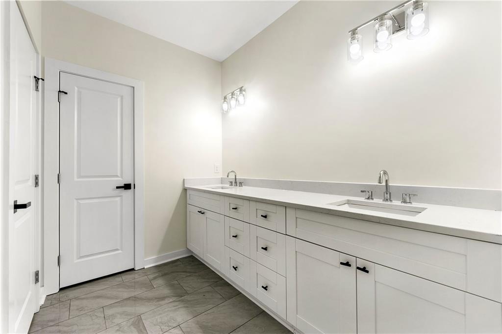 3607 Brycewood Drive Decatur, GA 30034 - Photo 11 of 15 a bathroom with a double vanity sink and mirror