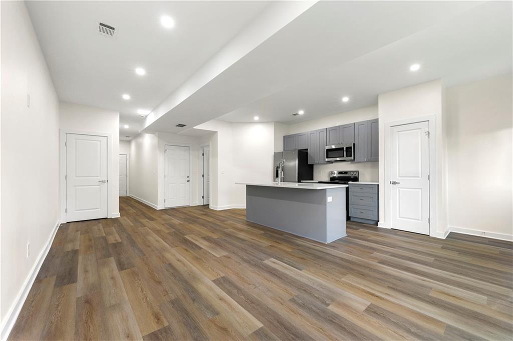 3607 Brycewood Drive Decatur, GA 30034 - Photo 14 of 15 a view of kitchen with kitchen island sink refrigerator and white cabinets
