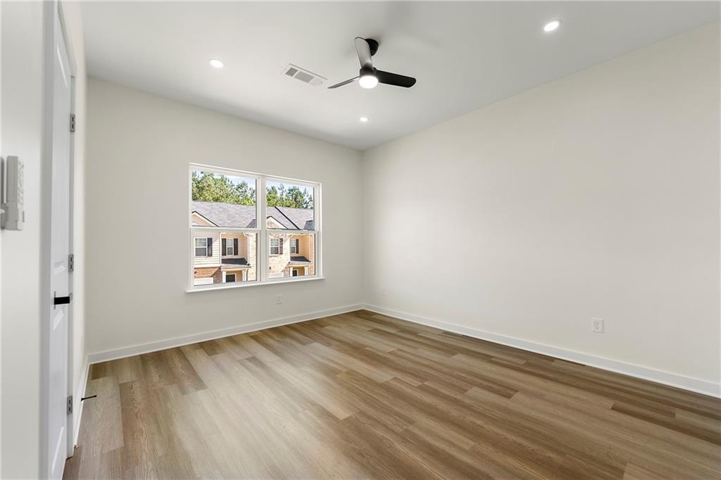 3607 Brycewood Drive Decatur, GA 30034 - Photo 10 of 15 wooden floor in an empty room with a window