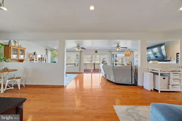 a view of a dining room with furniture and a potted plant