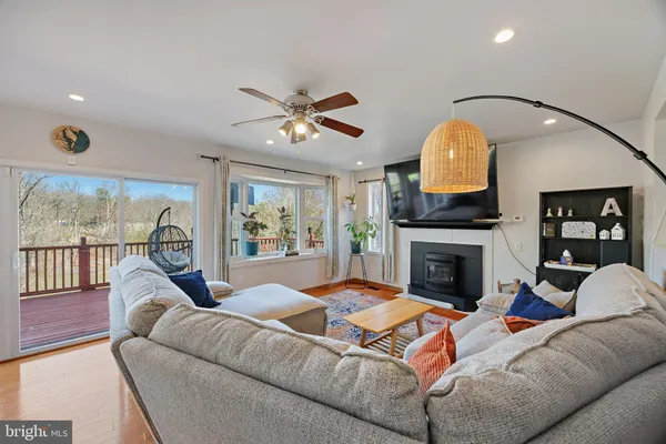 a living room with furniture and flat screen tv