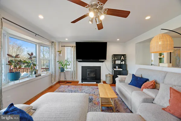 a view of a dining room with furniture and a kitchen