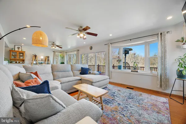 a bedroom with a bed and ceiling fan