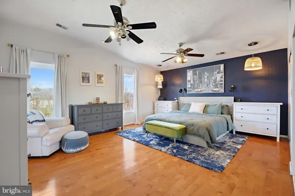 a kitchen with stainless steel appliances granite countertop a sink and a refrigerator
