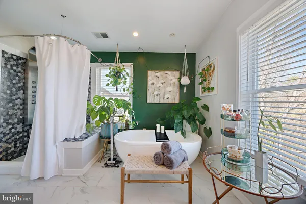 a bedroom with a large bed and a tv