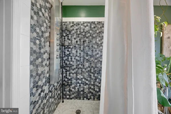 a kitchen with a refrigerator sink and cabinets