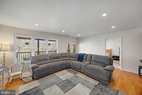 a view of a house with a backyard and sitting area