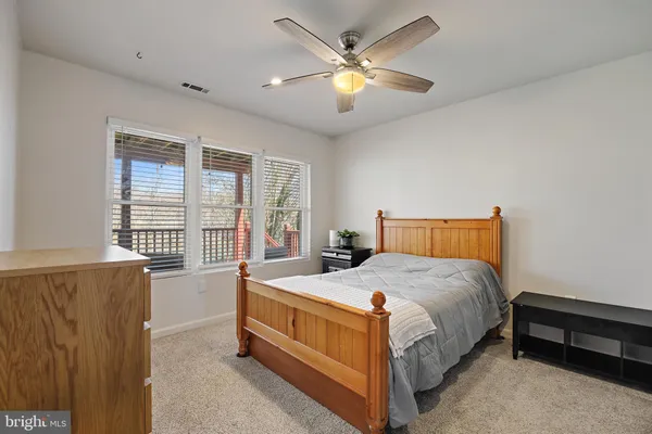 a view of a terrace with wooden floor and lake view