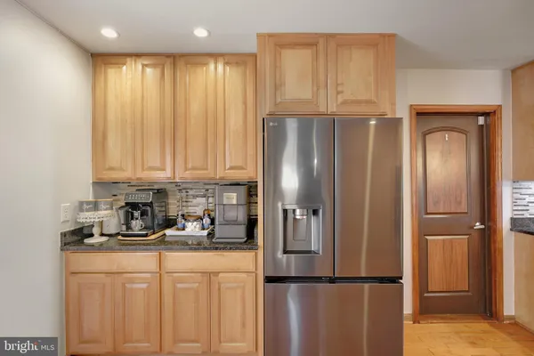 a living room with fireplace furniture and a wooden floor