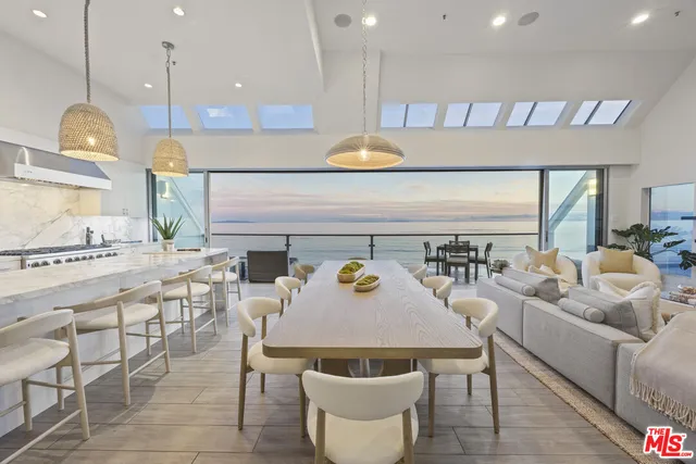 a kitchen with a table and chairs