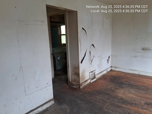 a view of a room with white walls