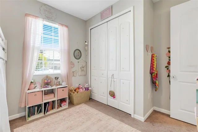 a room with window and furniture