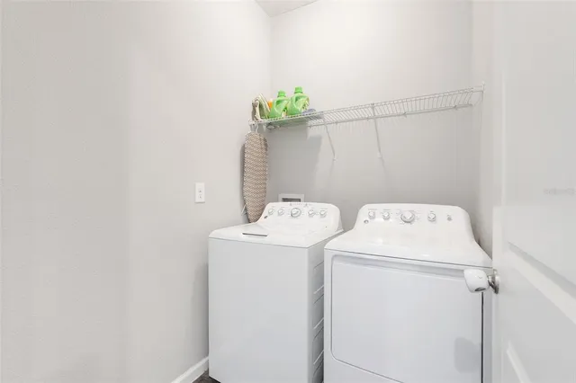 a utility room with dryer and washer