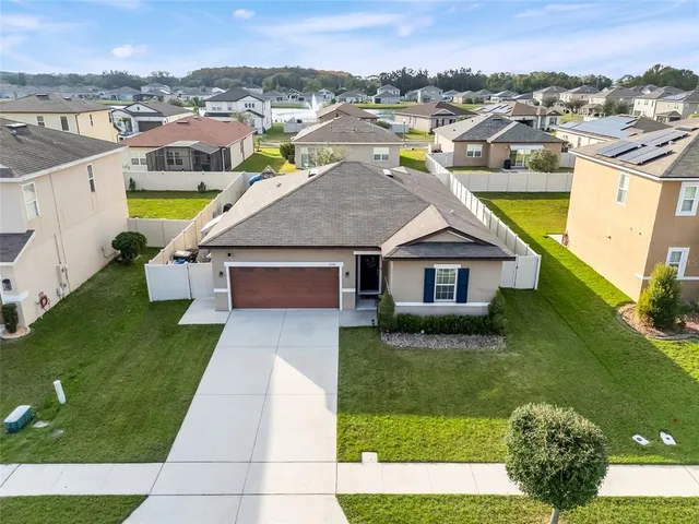 an aerial view of a house with a garden