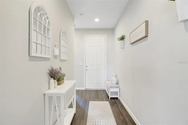 a view of entryway with wooden floor