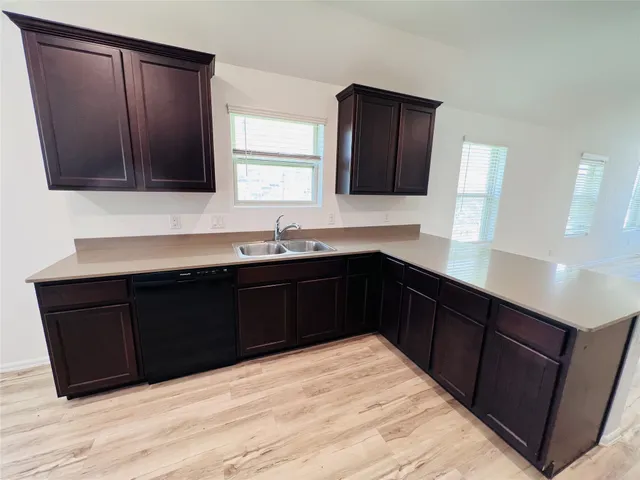 a kitchen with a sink and a microwave