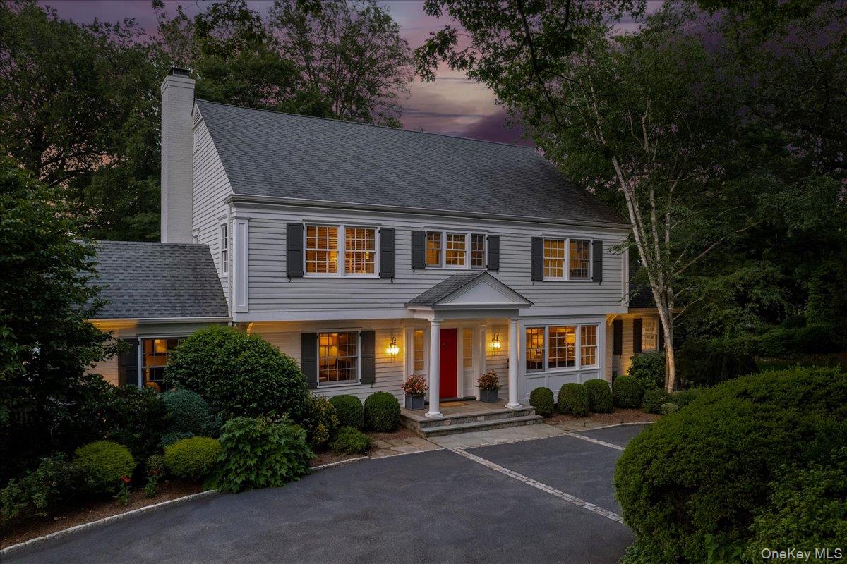 35 Seville Avenue Rye, NY 10580 - Photo 1 of 1 View of front of house featuring a porch, a chimney, and a shingled roof