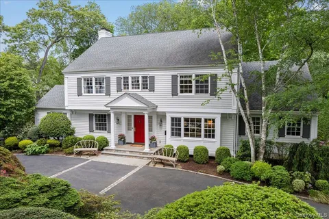 a aerial view of a house with yard and plants