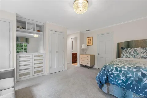 a bedroom with a bed and a cabinets