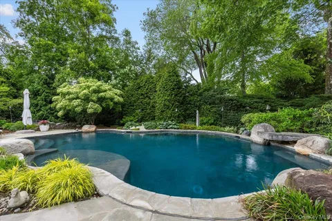 a view of a swimming pool with a patio