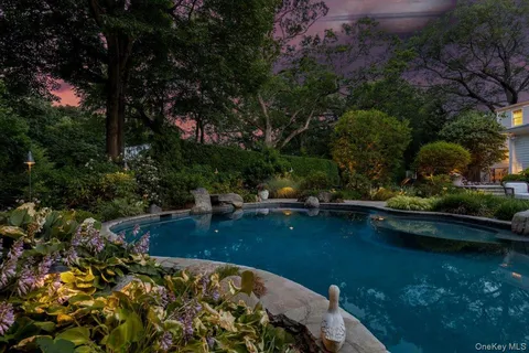 a view of swimming pool from a lake view