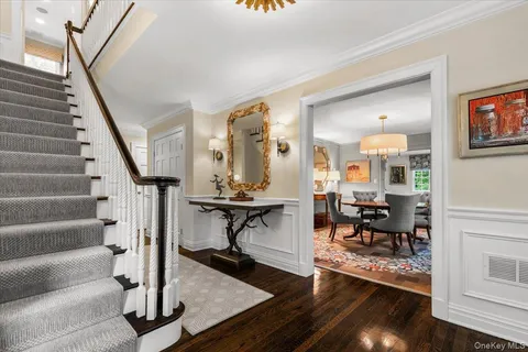 a view of a livingroom with furniture and hardwood floor