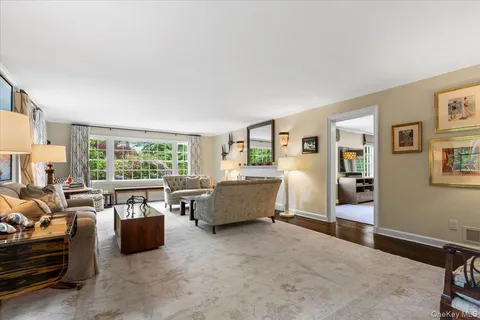 a living room with furniture and large windows