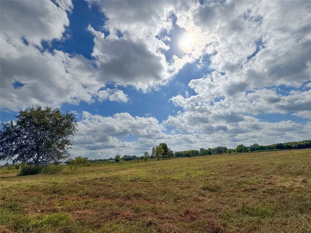 a view of lake with green space