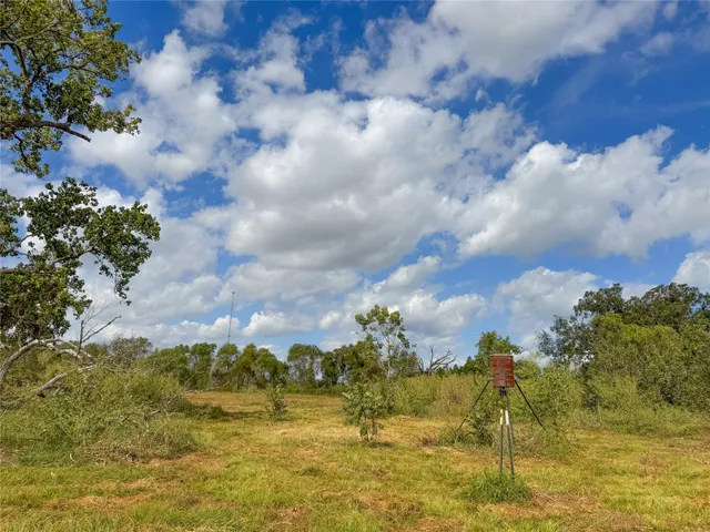 an aerial view of a houses with outdoor space