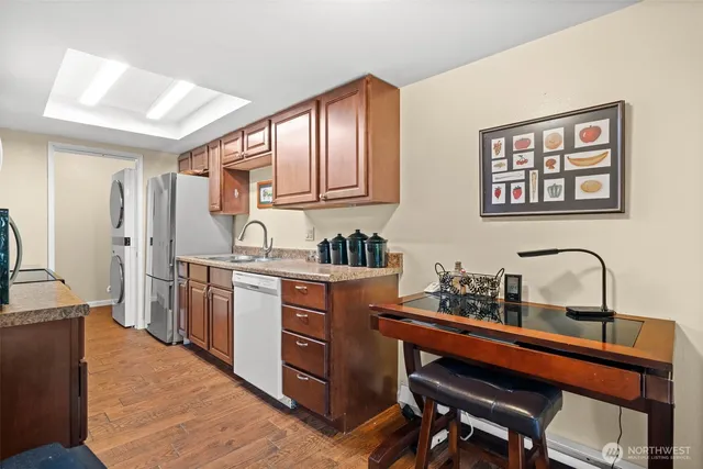 a kitchen with sink cabinets and stove
