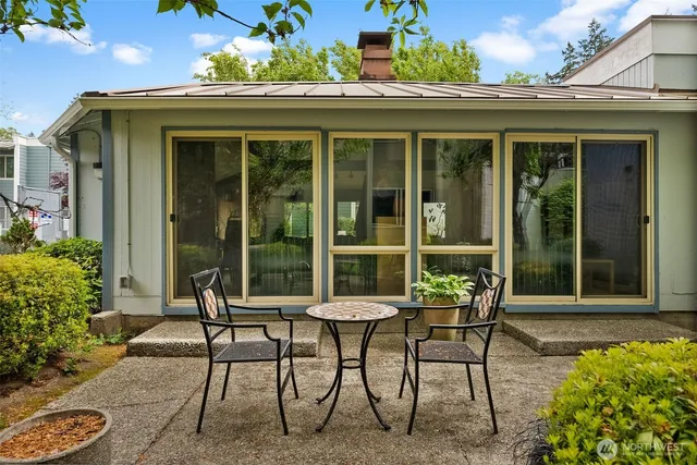 a view of a chairs and table in a patio