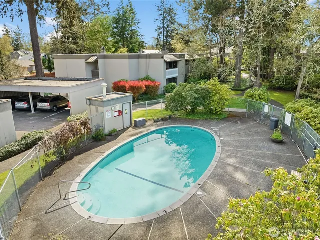 a view of a swimming pool with a patio