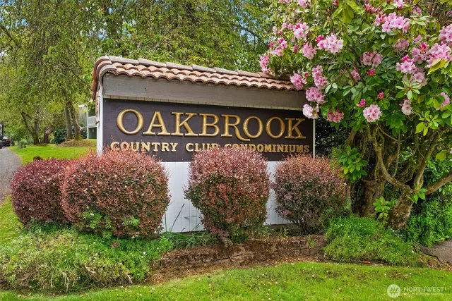 a sign broad in front of red brick house