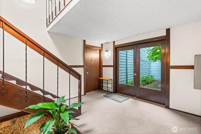 a view of an entryway with flower plants