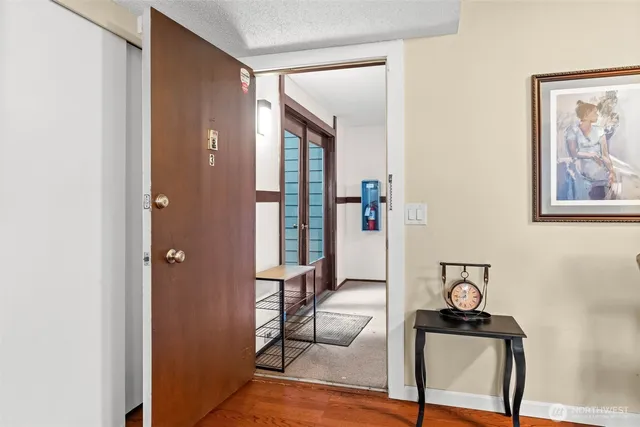 a view of a livingroom with furniture and windows