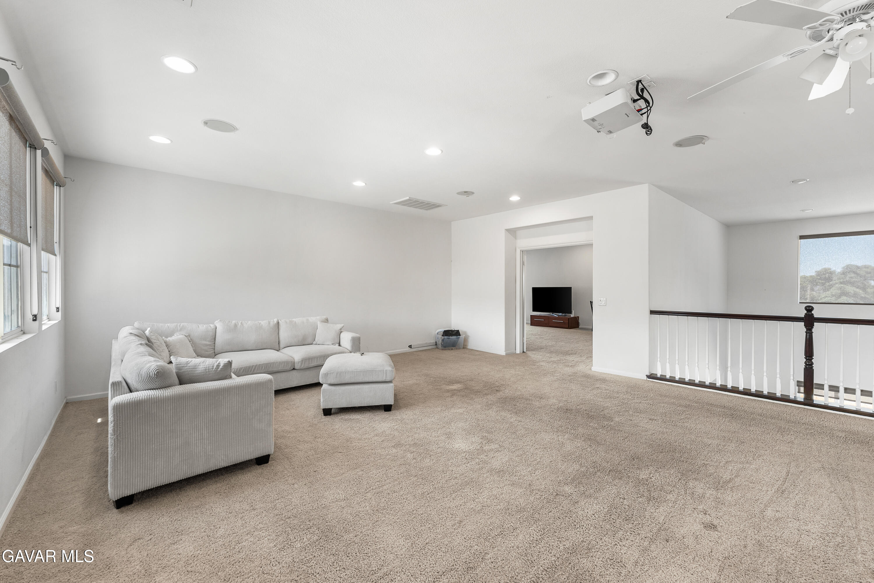 658 Lago Lindo Road Palmdale, CA 93550 - Photo 60 of 91 a living room with furniture and a chandelier