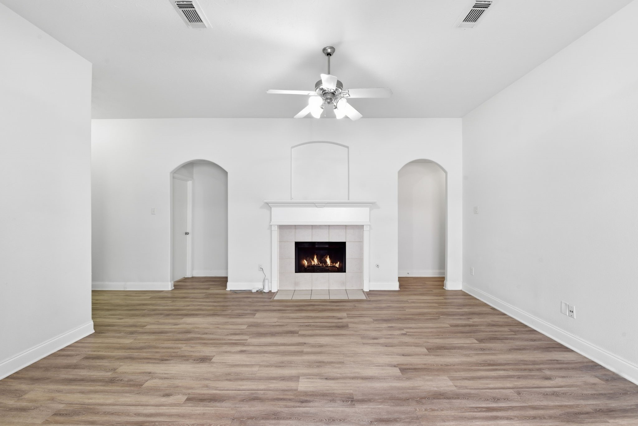 19013 Hammer Lane Porter, TX 77365 - Photo 11 of 35 a view of a room with chandelier fan and wooden floor