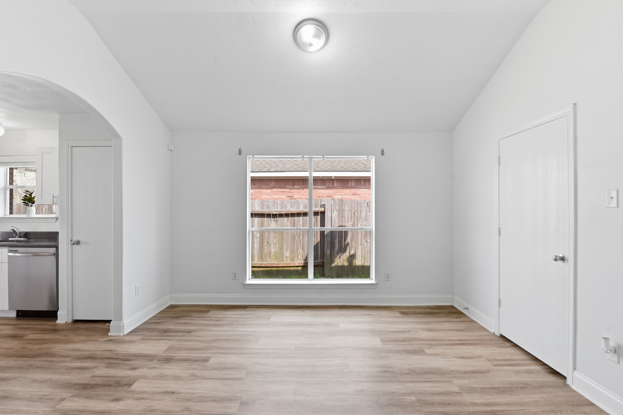 19013 Hammer Lane Porter, TX 77365 - Photo 12 of 35 an empty room with wooden floor and windows