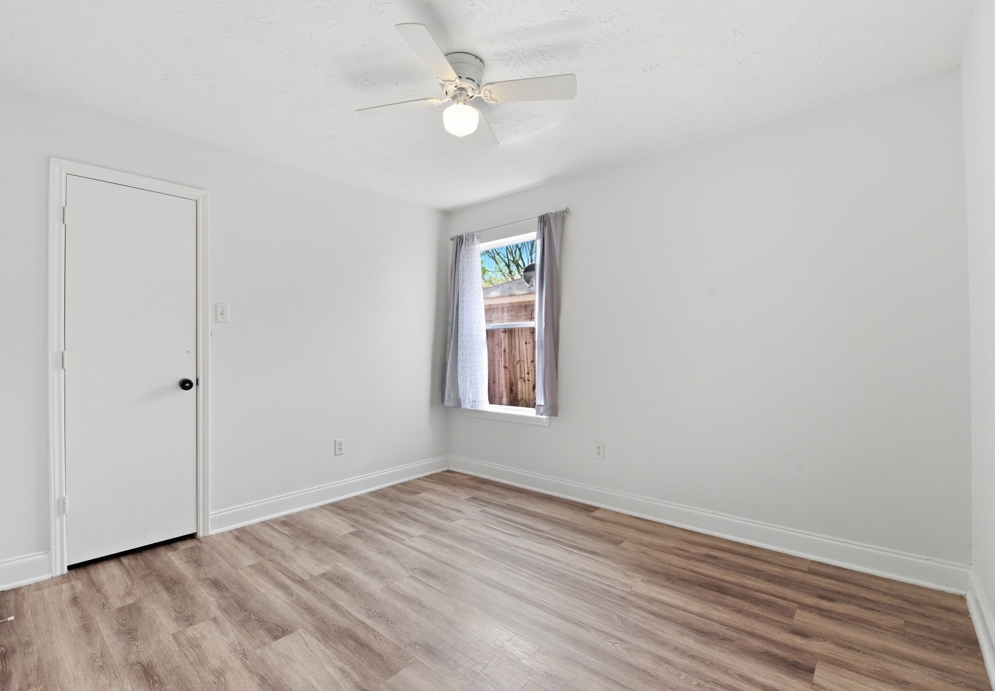 19013 Hammer Lane Porter, TX 77365 - Photo 16 of 35 wooden floor in an empty room with a window