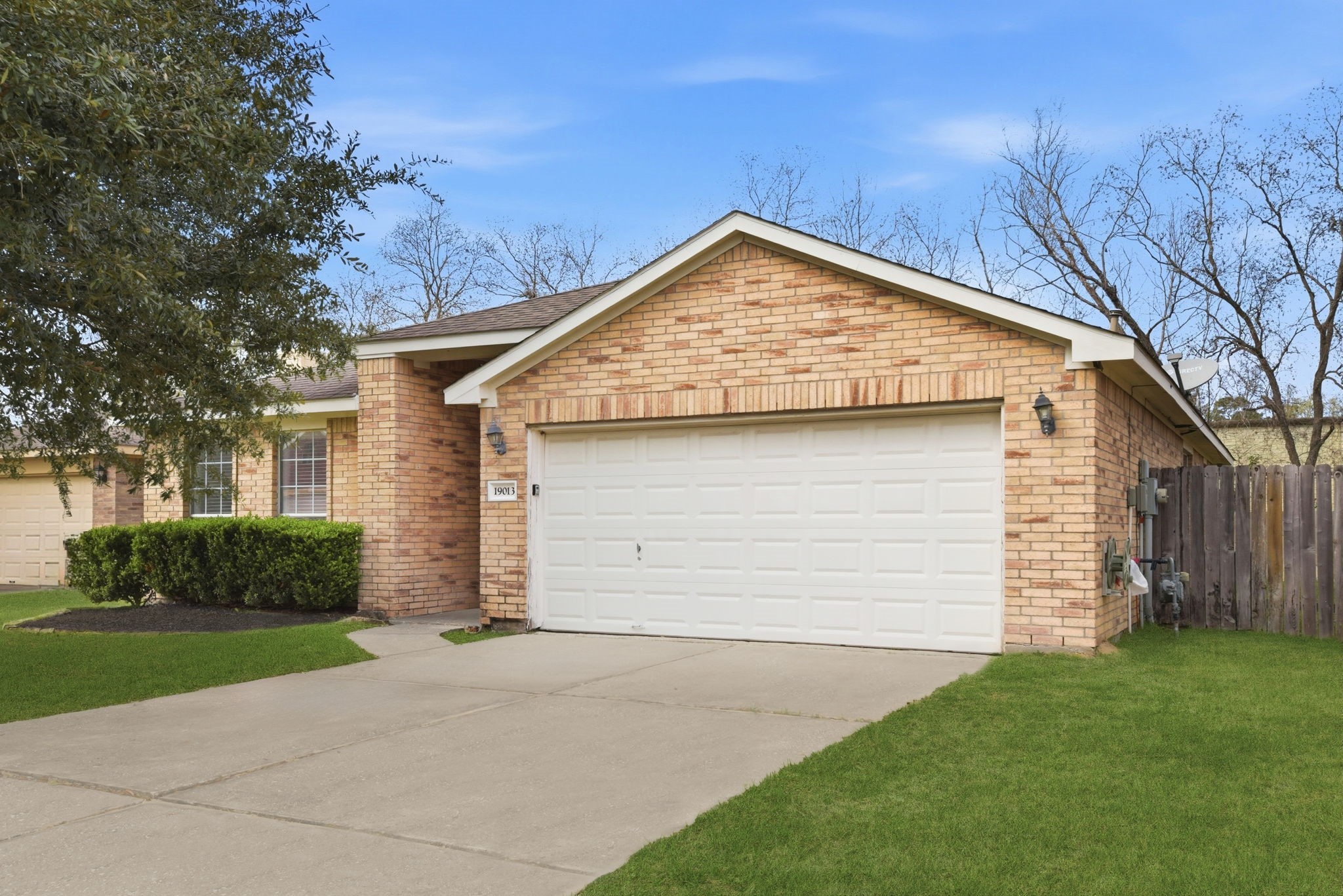 19013 Hammer Lane Porter, TX 77365 - Photo 2 of 35 a view of backyard of house and garage