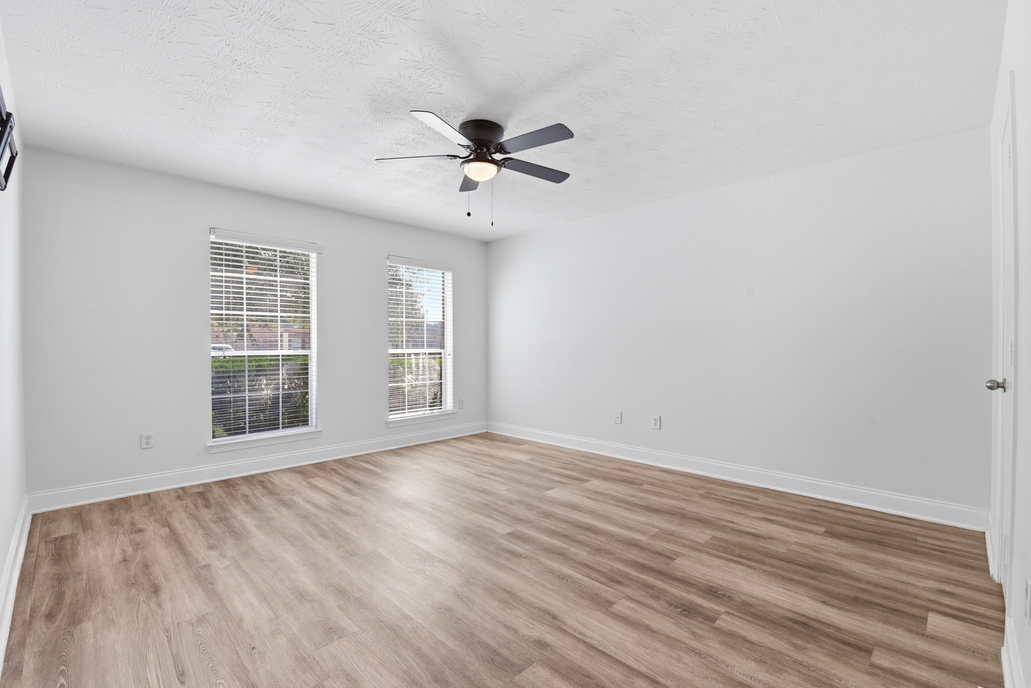 19013 Hammer Lane Porter, TX 77365 - Photo 23 of 35 a view of an empty room with a window and wooden floor