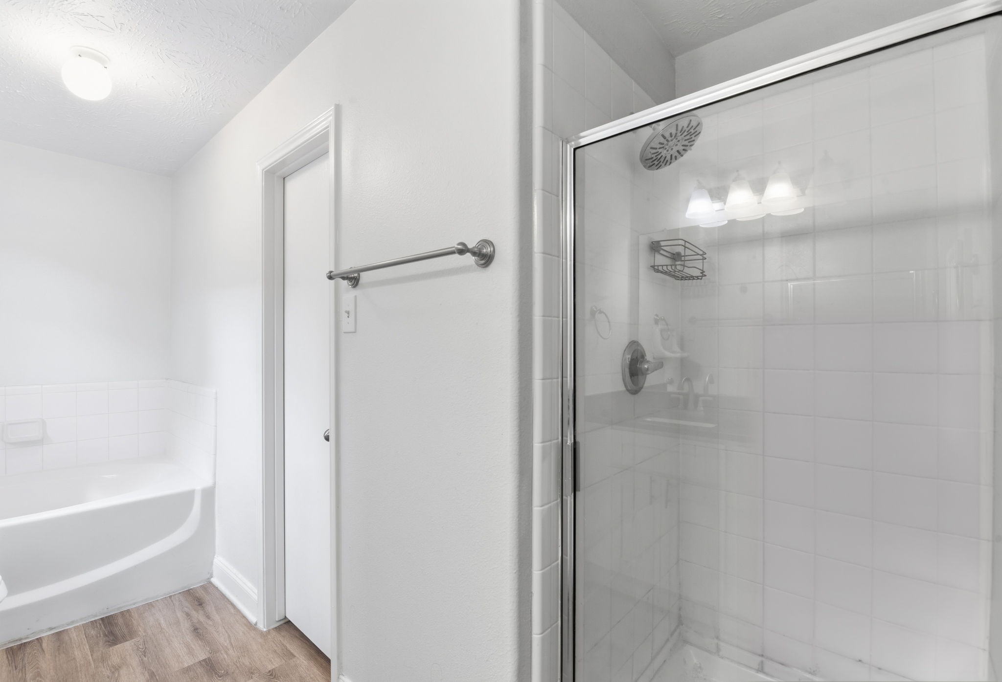 19013 Hammer Lane Porter, TX 77365 - Photo 27 of 35 a bathroom with a glass shower door and a bathtub