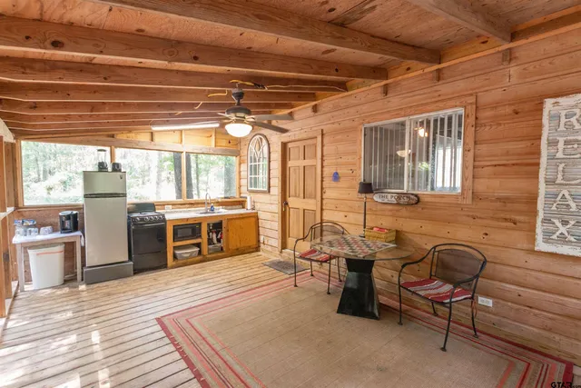 a outdoor space with lots of wooden furniture