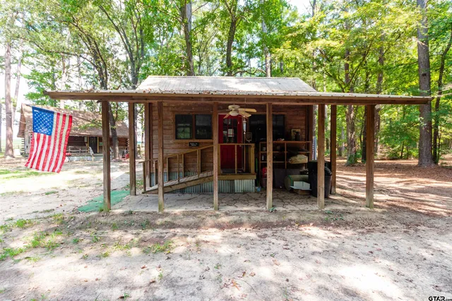 a view of a patio with a table and chairs